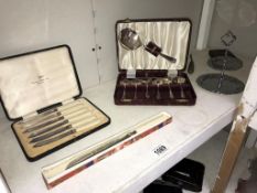 A cased set of Walker & Hall butter knives, cased set of dessert spoons,