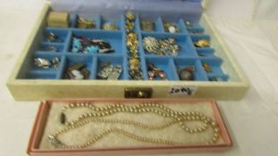 A jewellery box and mixed lot of costume jewellery including pearl necklace, earrings, brooches etc.