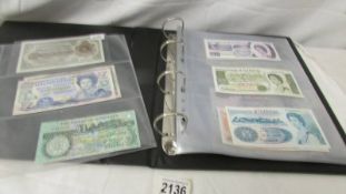An album of foreign bank notes including Falkland Islands, India, China, St.