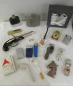 A mixed lot of cigarette lighters, 2 hip flasks, 2 clay pipes etc.