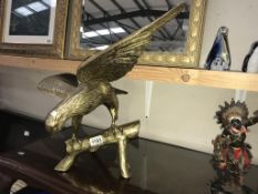 A large solid brass eagle with a 66cm wing span