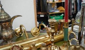 A shelf of brassware including pair of wall lights.