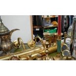 A shelf of brassware including pair of wall lights.