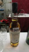 A Bottle of Talisker 10 year single malt Scotch whisky.