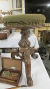 A Victorian mahogany revolving piano stool.