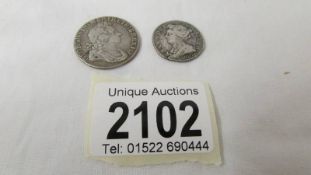 A George I 1723 one shilling and a Queen Anne 1703 sixpence.