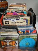 A mixed lot of 45 rpm records and CD's.