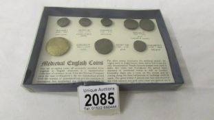 A set of replica medieval English coins.
