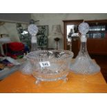 2 cut glass ships decanter and a glass bowl.