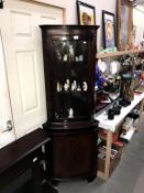 A modern astral glazed corner cupboard height 180cm (foot will need attention)