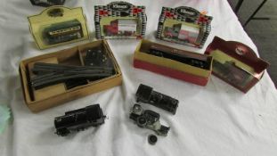 Four boxed die cast vehicles, model trains etc.