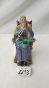 A Royal Doulton figure 'A Stitch in Time', HN2352.