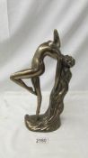 A contemporary bronze effect nude figure signed Rosa, 33 cm tall.