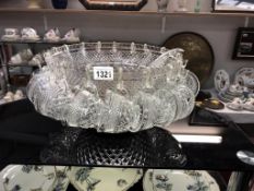 A large punch bowl complete with 18 glasses and hooks,