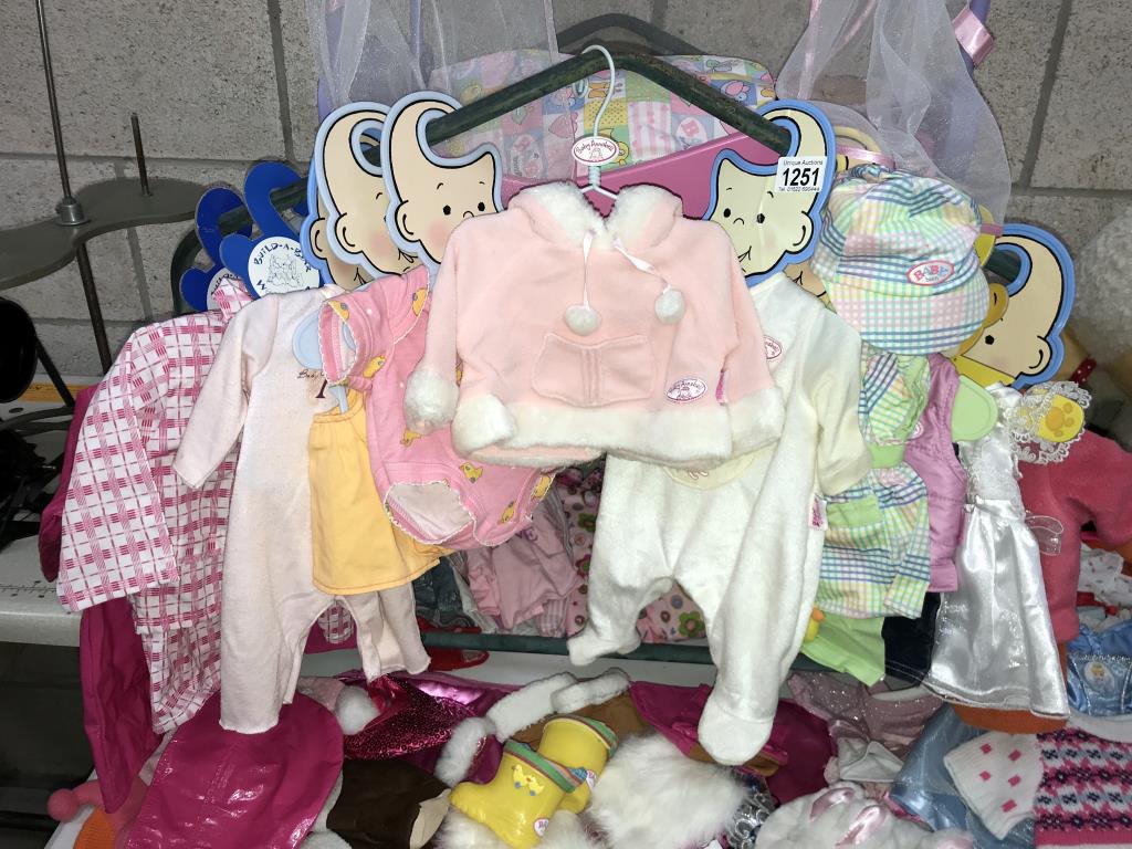 A quantity of doll's clothes & a cot with Doll - Image 4 of 7