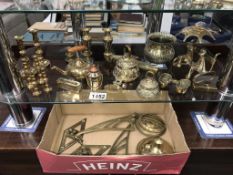 A mixed lot of small brass items including candlesticks & bells etc.