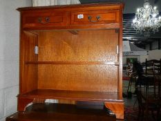 A mahogany book case with 2 drawers.