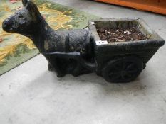 A garden horse and cart planter.
