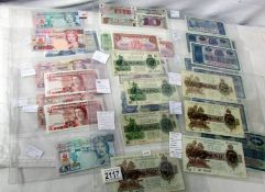 A collection of old bank notes including Gibraltar, British Linen Bank, Armed Forces Bank etc.