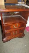 A two drawer mahogany chest.