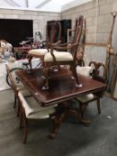 A dark wood stained extending dining table and 2 leaves and 6 chairs, height 78cm,