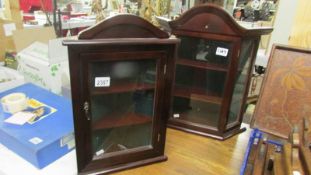A small display cabinet and a small corner display cabinet.