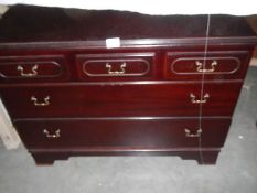 A 2 over 2 mahogany chest of drawers.