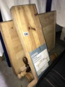 A large heavy duty wooden chopping board & a quantity of rolling pins etc.