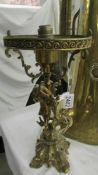 A heavy brass cherub table lamp (in need of re-wiring).