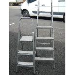 Two aluminium step ladders.