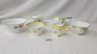 Three Shelley sugar bowls and milk jugs - 'Balloon Tree', 'Dots' and 'Daisy'.