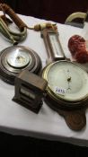 A mid 20th century Smith's barometer, another barometer and a perpetual calendar.