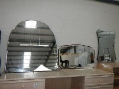 A bevel edged mirror and 2 others.