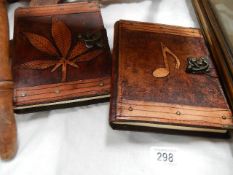 Two leather bound sketch books.