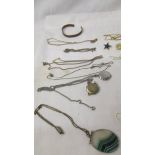 A mixed lot of costume jewellery including white and yellow metal chains, necklaces, bracelet,