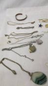 A mixed lot of costume jewellery including white and yellow metal chains, necklaces, bracelet,