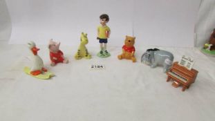 A Beswick Christopher Robin, Piglet, Hee Haw, Winnie the Pooh, Tigger, Piano and Dusk on Ski's.