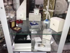 A collection of Swarovski collectors society gifts including swans, hearts,