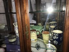 A quantity of pottery including loving cup, candlestick,