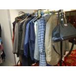 A rail of assorted clothing including coats, jackets, shirts etc., (some vintage).