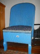 A blue wicker bedroom chair.