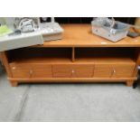 A low teak sideboard.