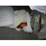 A large lot of assorted bed covers, curtains etc.