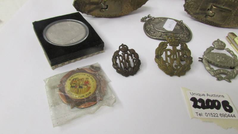 A mixed lot including 2 brass tanks, military badges, buttons, pen knives etc. - Image 4 of 4