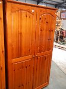 A pine 2 door wardrobe.