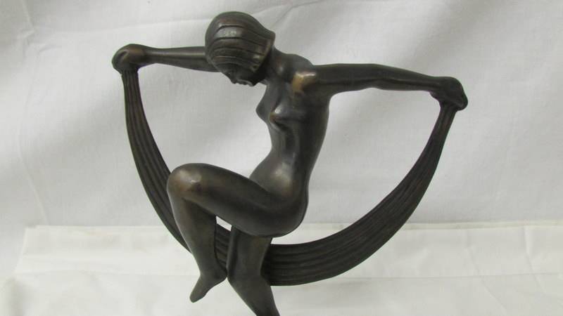 A contemporary bronze figure of a nude dancer, 24 cm tall. - Image 2 of 2