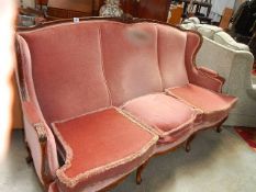 A French mahogany framed sofa.