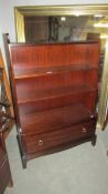 A mahogany 2 drawer book case, 114 x 77 cm.