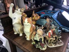 A mixed lot including cat and dog figures.