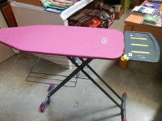 A good quality Ewbank ironing board on sliding wheels.